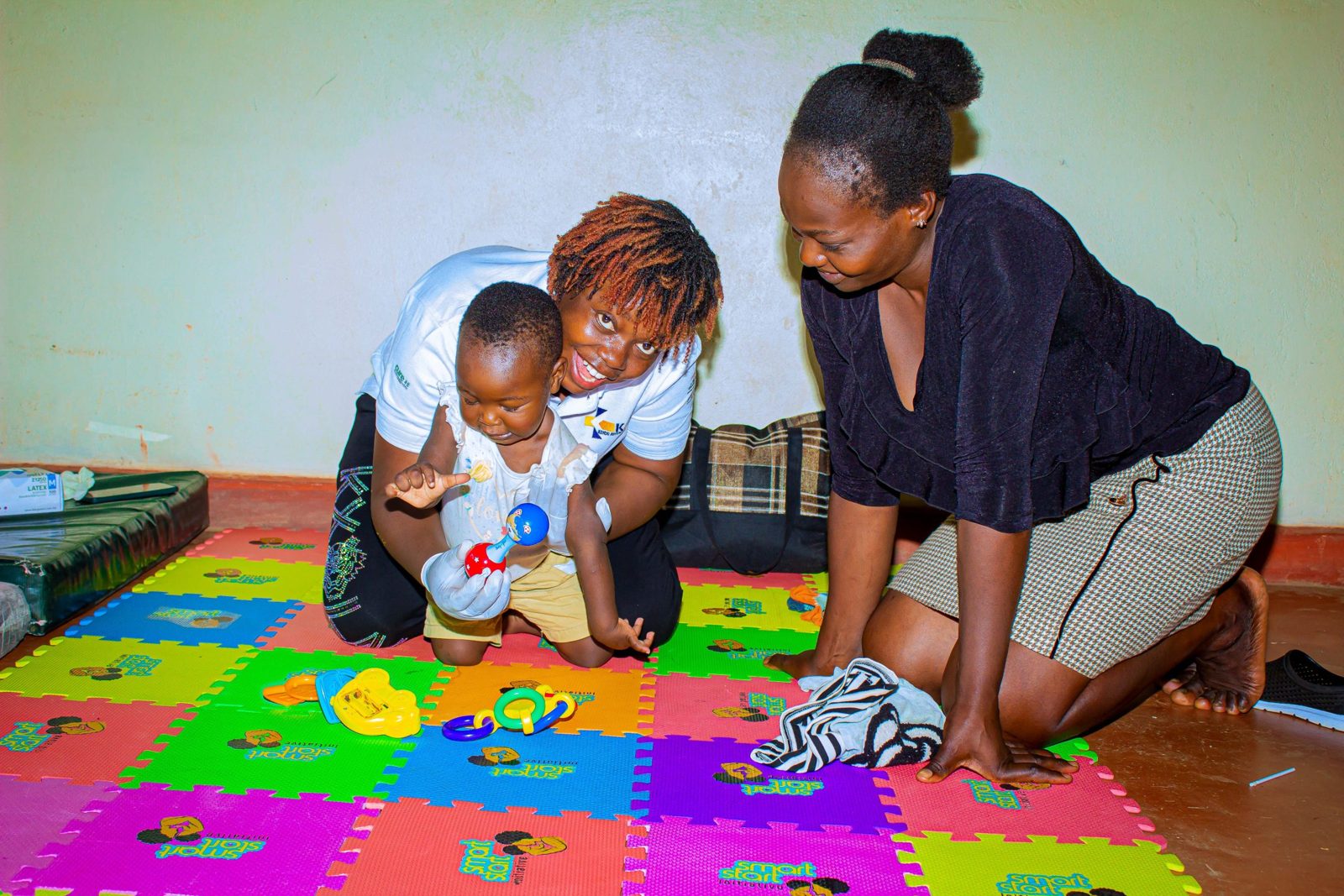 A therapist working with a child and parent